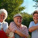 A diverse group of active, happy seniors engaging in outdoor activities, symbolizing healthy aging